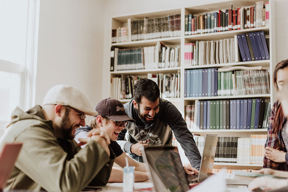 Team members happily collaborating in a modern office environment